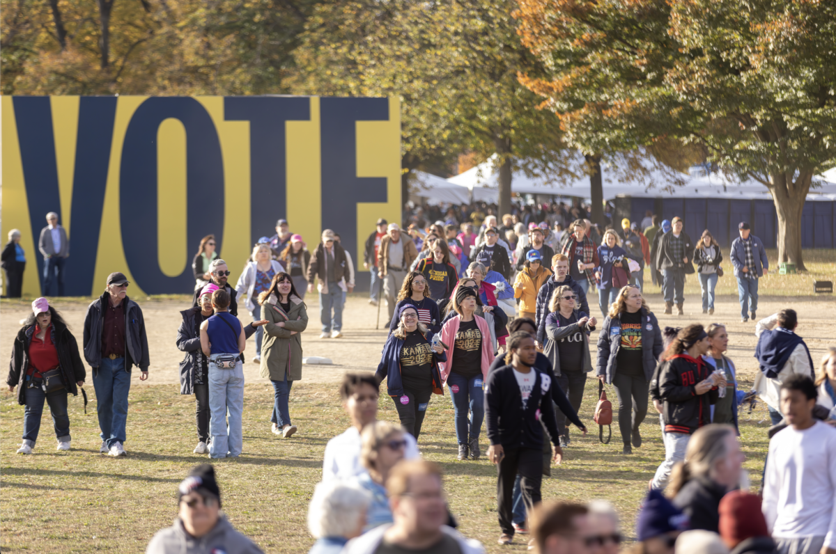 Spectators eagerly walk to their get as close to the stage as possible at the Ann Arbor Harris/Walz Rally. The anticipation leading up to the event was palpable.